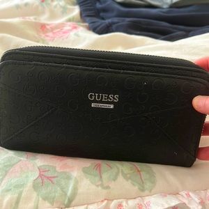 I am selling this cause I never use it it is a blue leather guess wallet